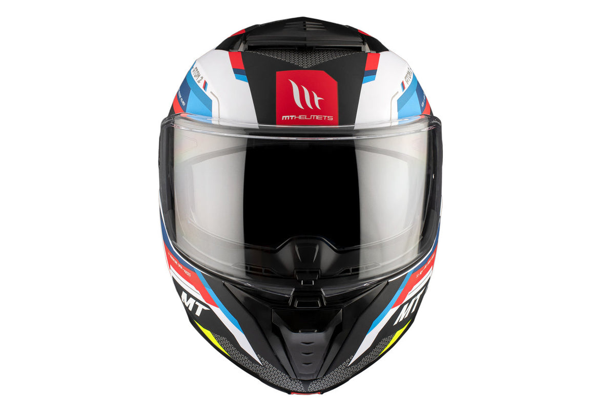 Frontal vy av MT Helmets mc-hjälm Atom 2 SV Blast A0 Pearl med aerodynamisk design, klart visir och färgstark grafik för motorcykelförare.